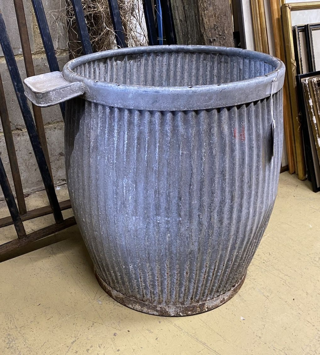 A circular galvanised grain bin, height 53cm